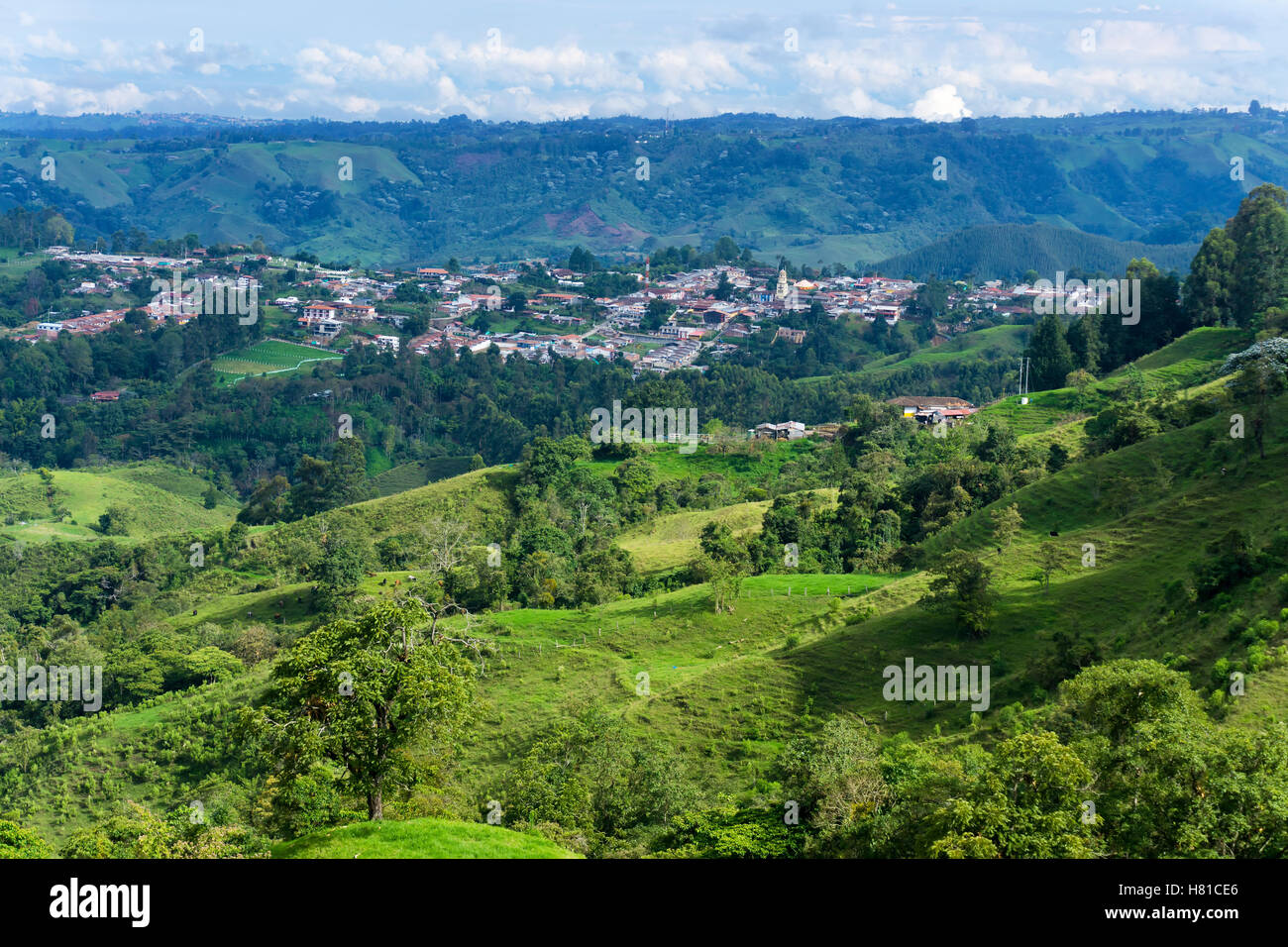 Beautiful lush green landscape with the town of Salento, Colombia visible in the background Stock Photo