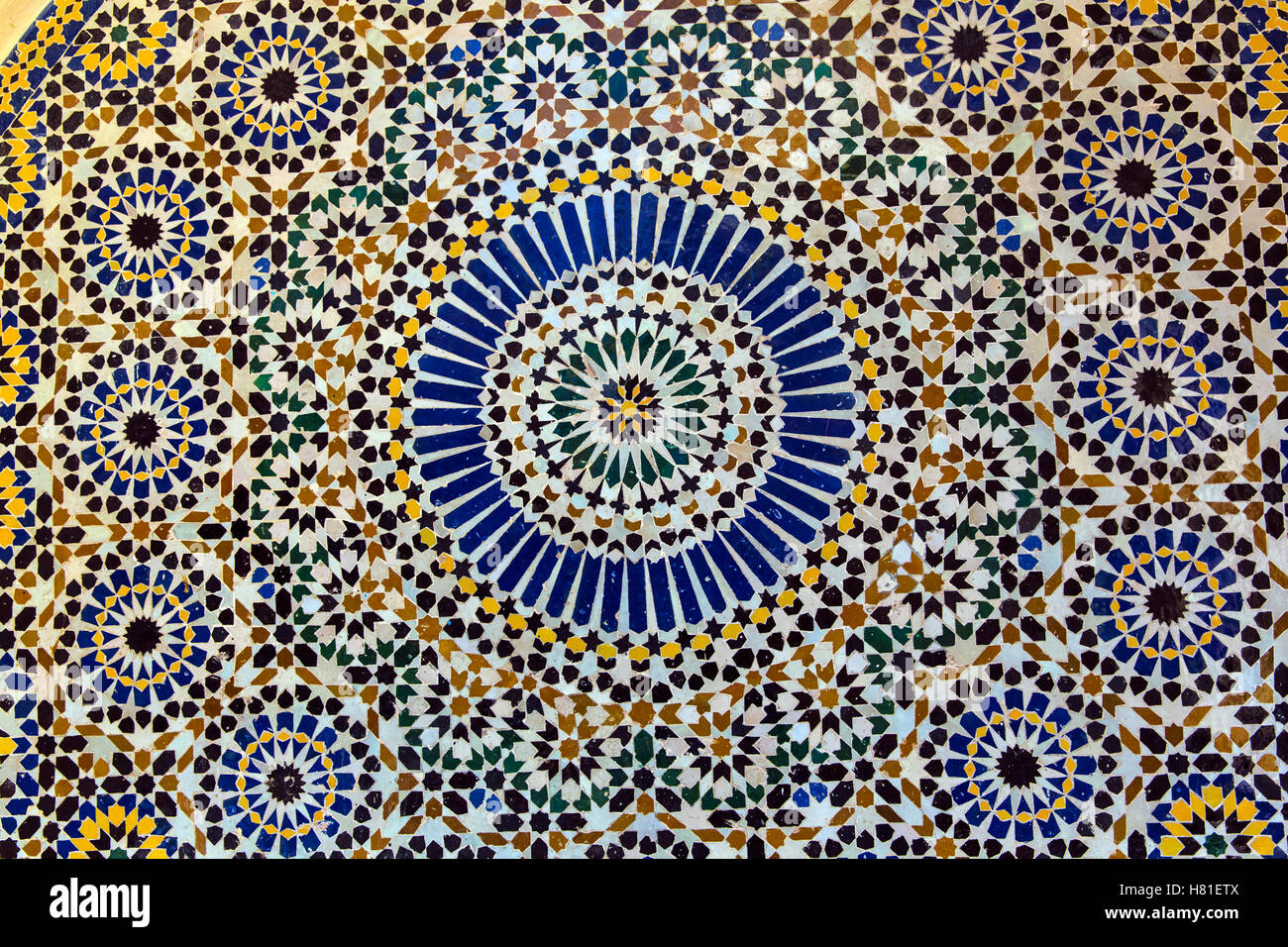 Morocco, tile work, Zellige (sometimes called Zellij or Zelige) is a form of Arab art that occupies an important place in Moroccan architecture. Stock Photo