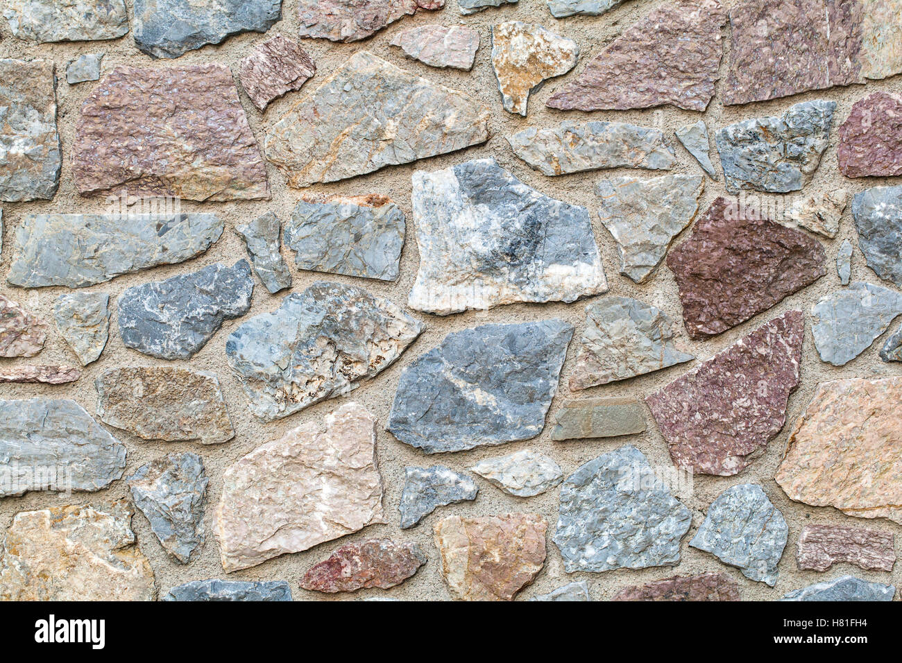 Rustic stones wall background Stock Photo - Alamy