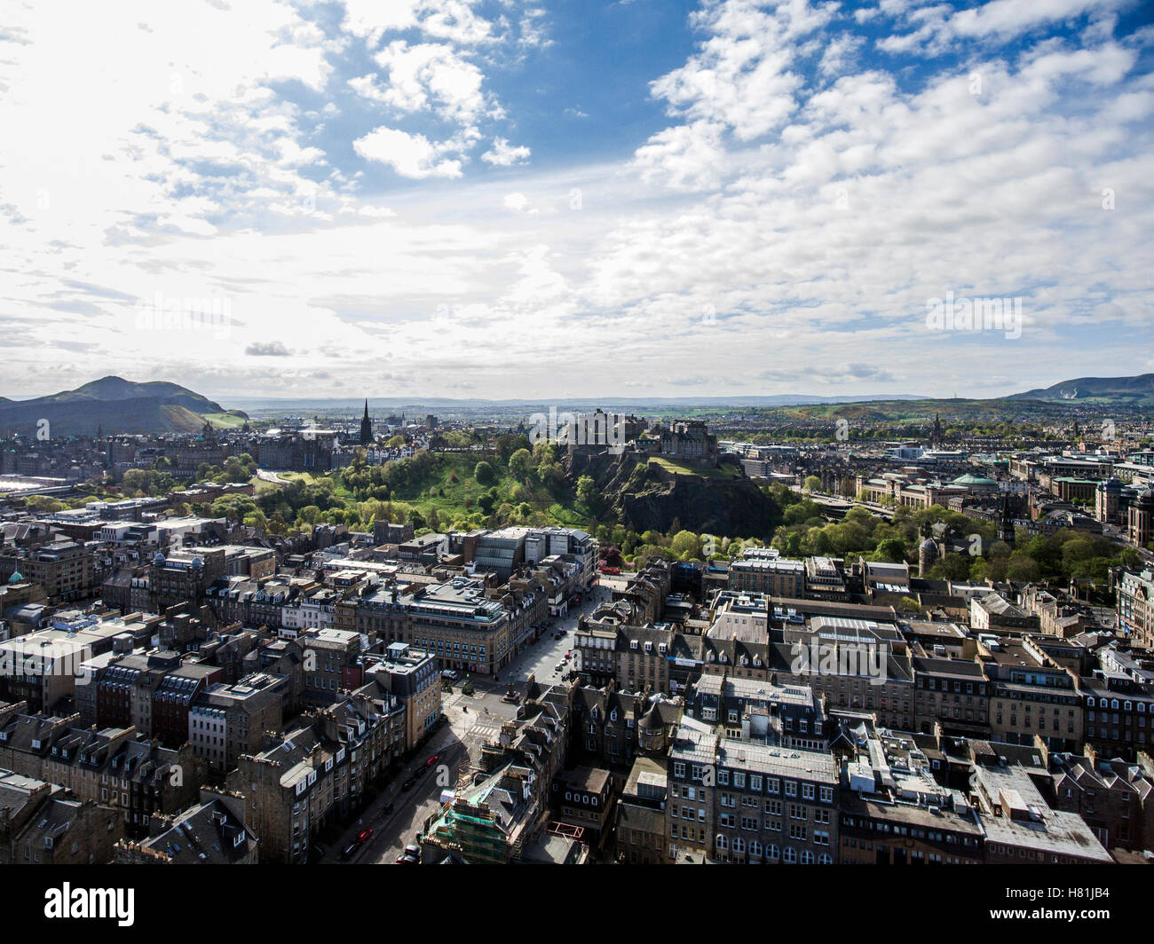 Edinburgh city the historic Castle Rock sunny Day Aerial shot Stock Photo