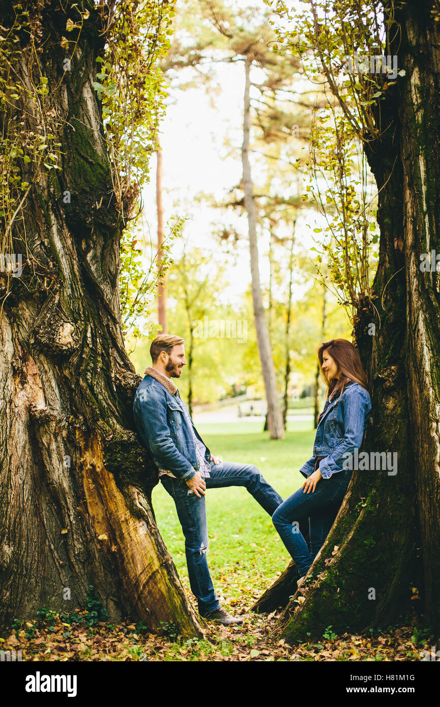 Loving young couple in the autumn park Stock Photo - Alamy