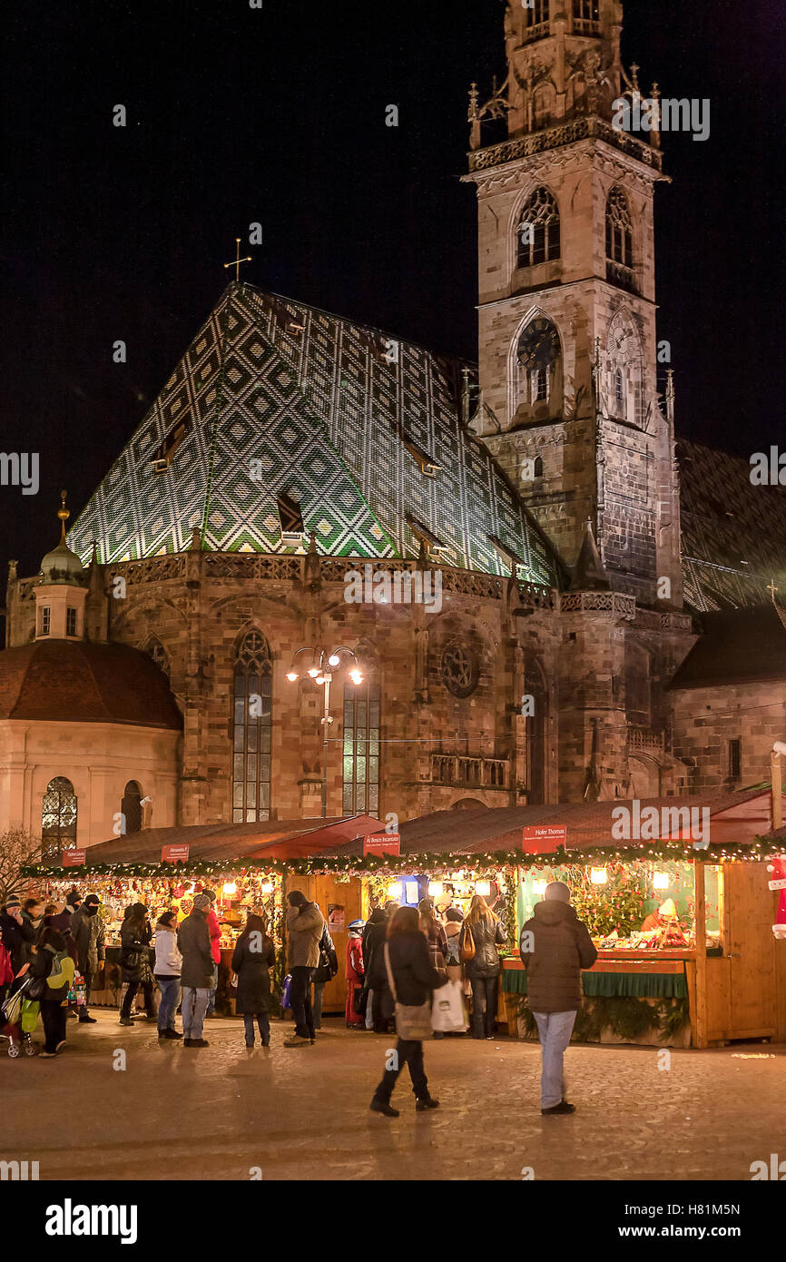 Christmas market in front of Bolzano cathedral in the evening, Bolzano, South Tyrol, Alto Adige, Italy, Europe Stock Photo