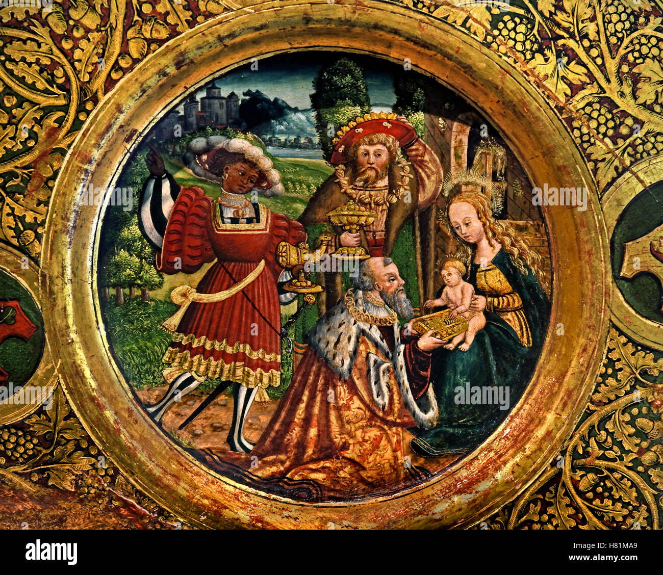 Dish with adoration of the three kings ( the magi ), 1528 Luneburg, oil painting and gilding on wood. The kings from the Orient, in the German Renaissance costume, offer precious vessels, on the edge the coat of arms of the Luneburg families Stoterooge, Stokete, Elver, and Gloden.  German, Germany, Stock Photo