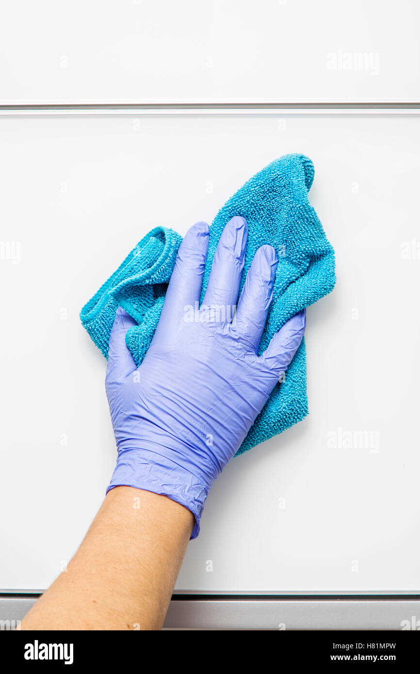 Hand with glove clean cloth surface Stock Photo