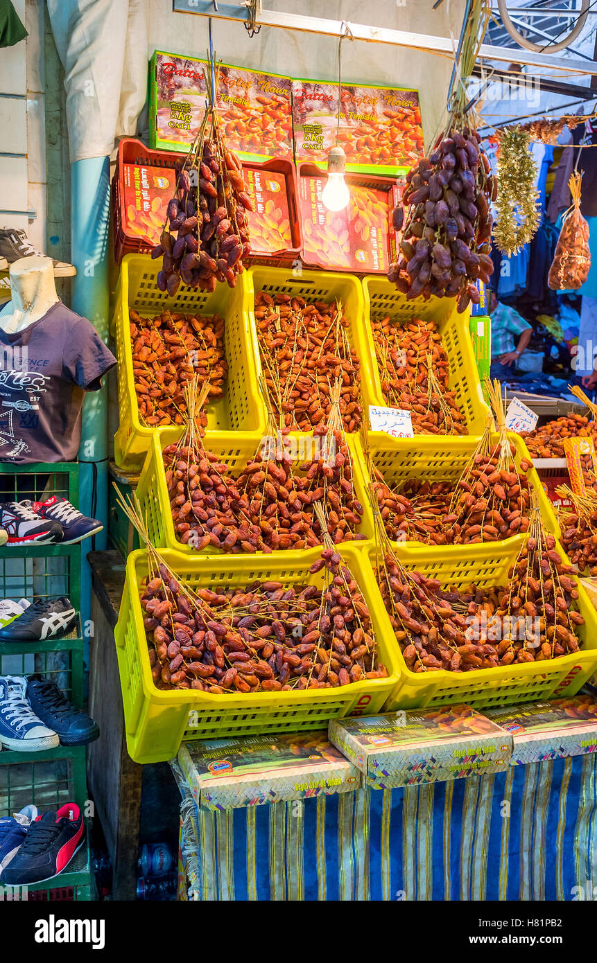 The local grocery offers the wide range of the dried dates on branches and in gift boxes Stock