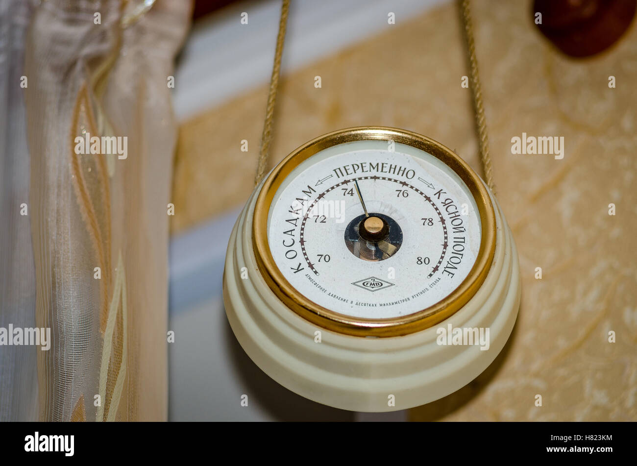The barometer hanging on the wall in the apartment of the unit of