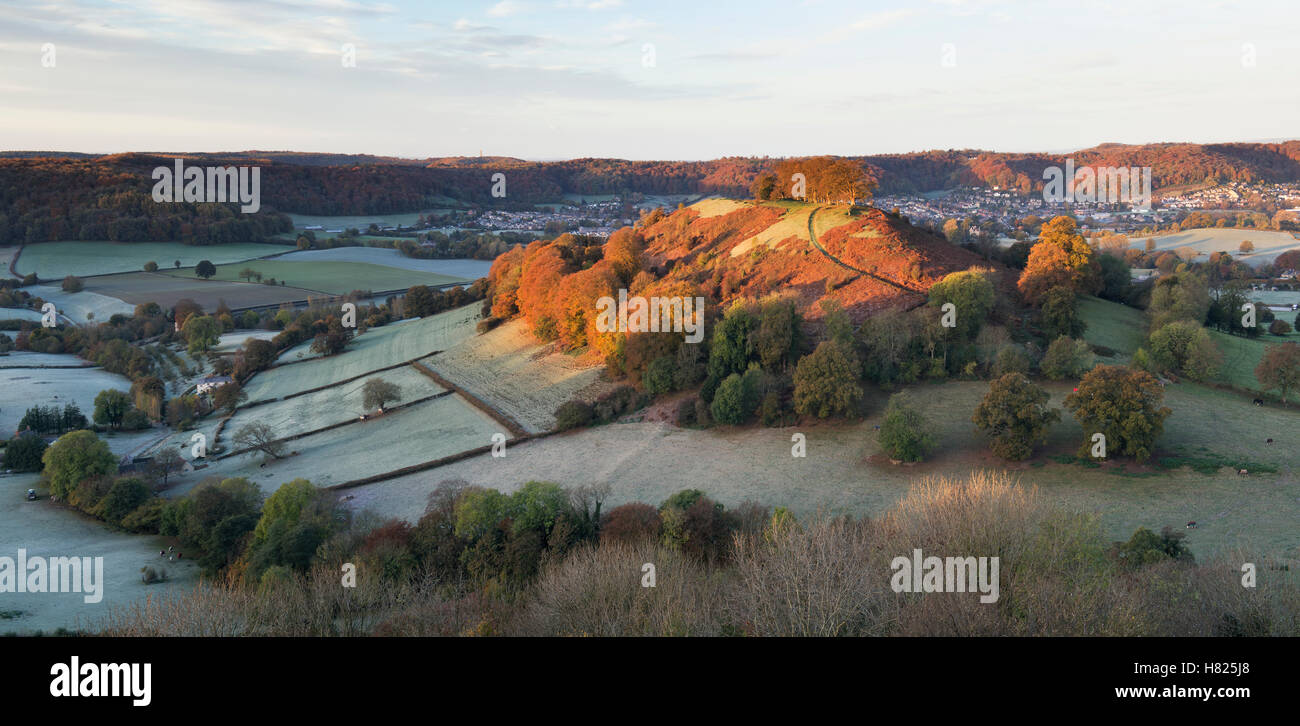 Downham Hill from Uley Bury on a cold frosty autumn morning at sunrise. Cotswolds, Gloucestershire, England. Panoramic Stock Photo