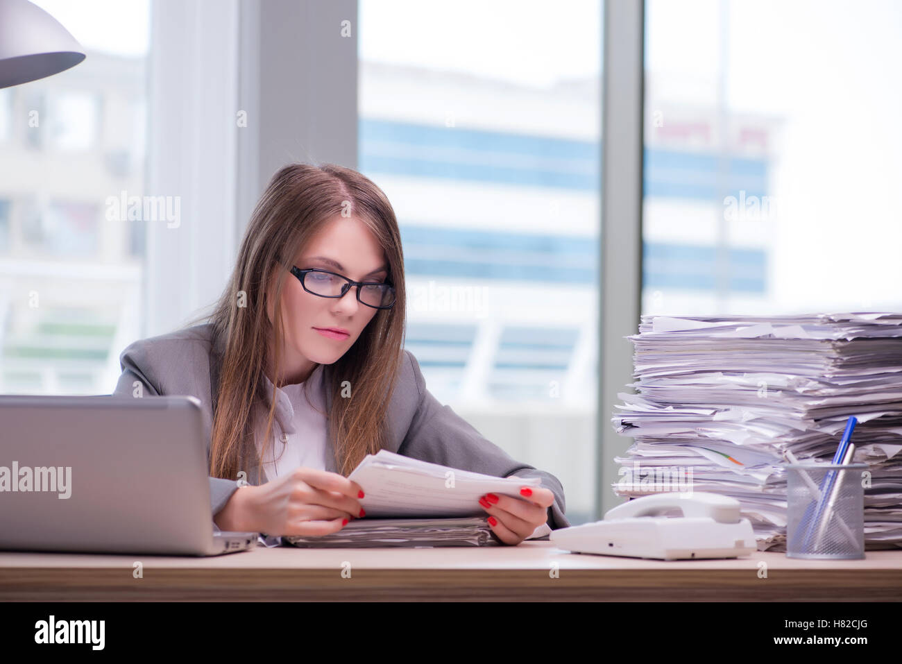 Businesswoman working in the office Stock Photo - Alamy