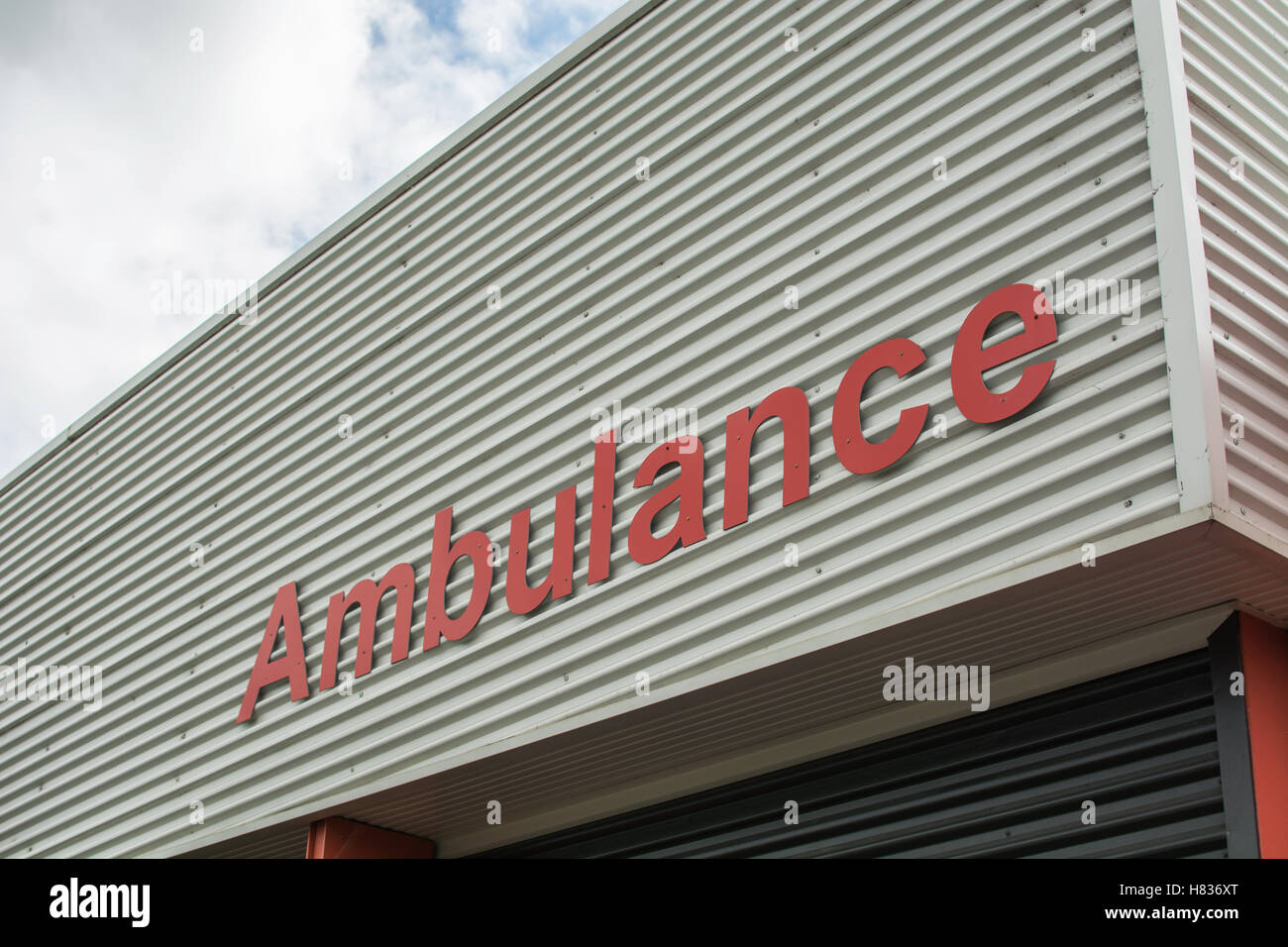 Low angle of metal ambulance sign on steel building Stock Photo - Alamy