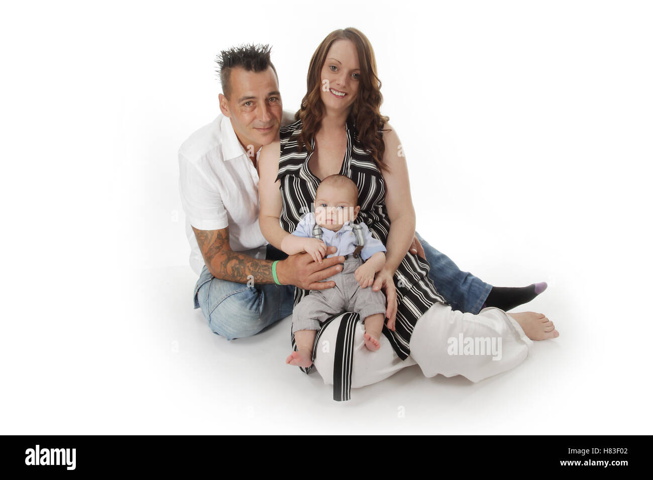 Mummy and daddy holding new born baby, family Stock Photo