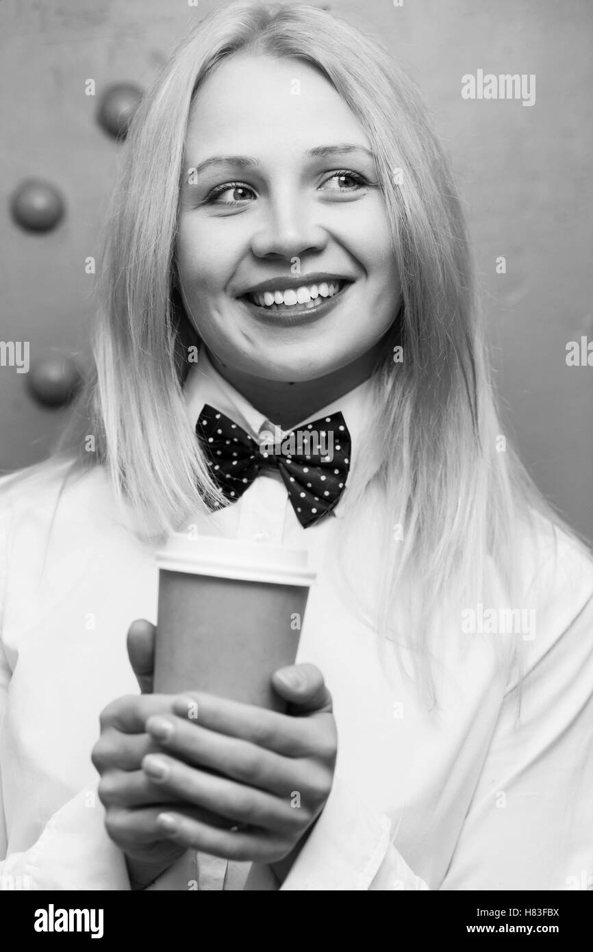 girl with paper cup of coffee. black-white photo Stock Photo