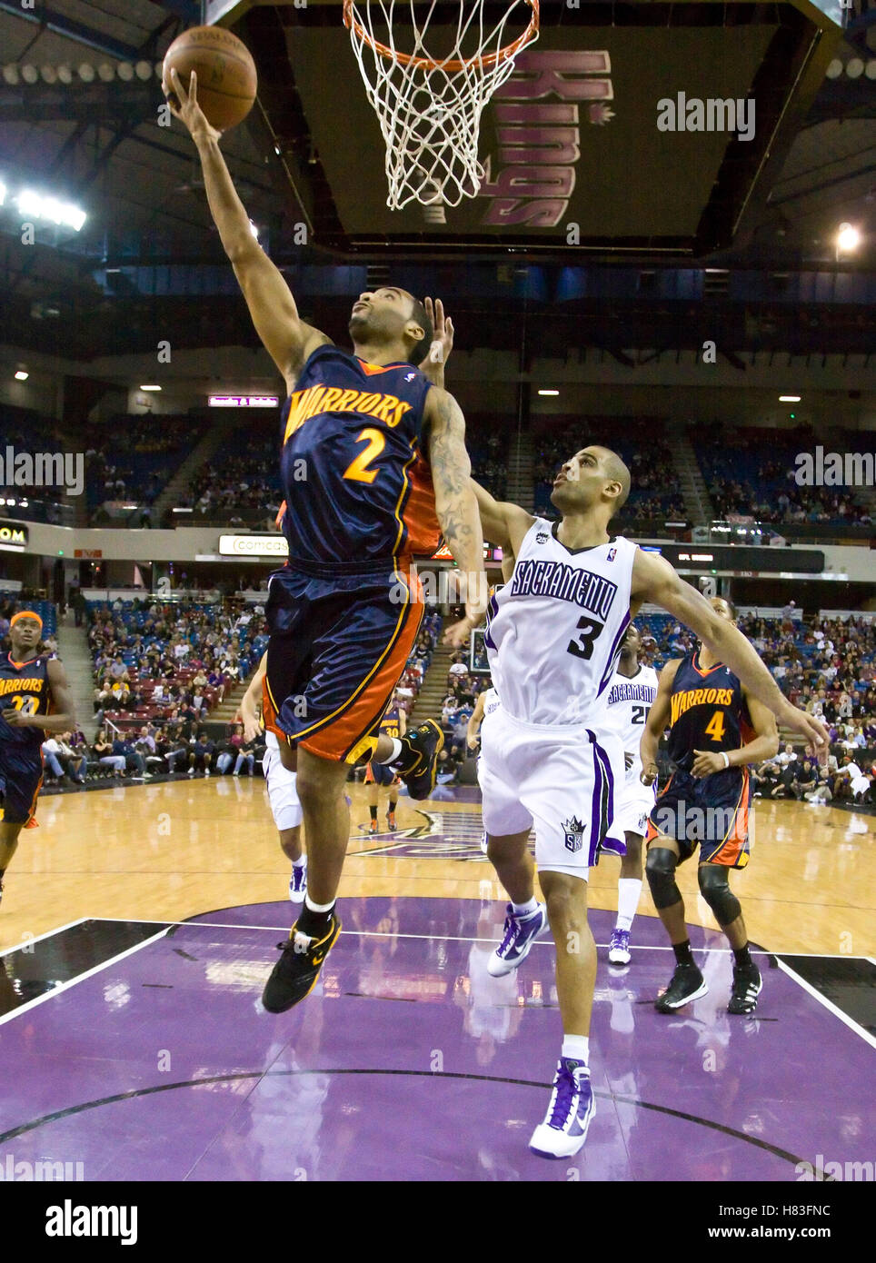 November 8, 2009; Sacramento, CA, USA;  Golden State Warriors guard Acie Law (2) shoots past Sacramento Kings forward Ime Udoka (3) during the fourth quarter at the ARCO Arena. The Kings defeated the Warriors 120-107. Stock Photo