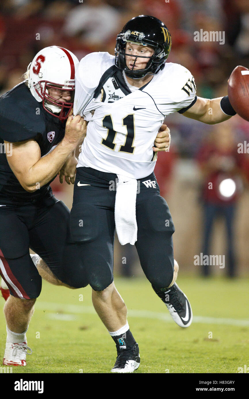 September 18, 2010; Stanford, CA, USA; Wake Forest Demon Deacons quarterback Tanner Price (11) is forced to intentionally ground a pass by Stanford Cardinal linebacker Owen Marecic (48) during the second quarter at Stanford Stadium. Stock Photo