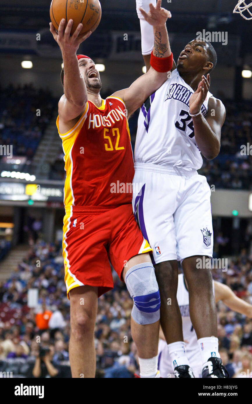 March 7, 2011; Sacramento, CA, USA;  Houston Rockets center Brad Miller (52) is defended by Sacramento Kings center Jason Thompson (34) during the second quarter at the Power Balance Pavilion. Stock Photo