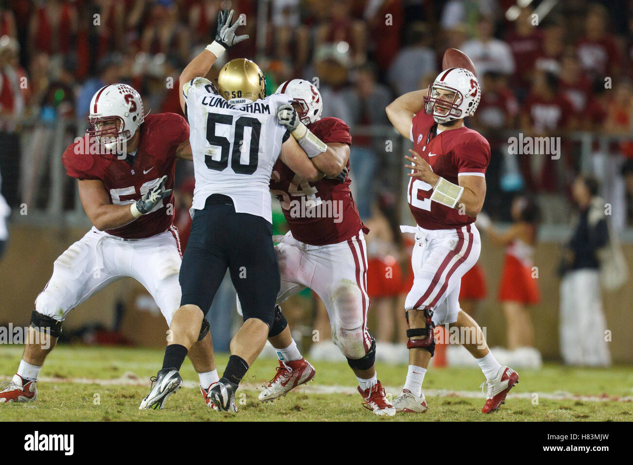 Oct 8, 2011; Stanford CA, USA;  Stanford Cardinal quarterback Andrew Luck (12) passes over Colorado Buffaloes defensive tackle Curtis Cunningham (50) during the fourth quarter at Stanford Stadium.  Stanford defeated Colorado 48-7. Stock Photo