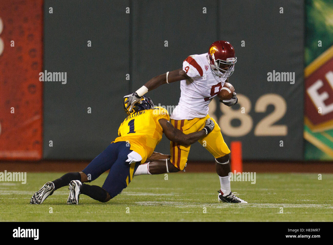 Oct 13, 2011; San Francisco CA, USA;  Southern California Trojans wide receiver Marqise Lee (9) is tackled by California Golden Bears defensive back Steve Williams (1) during the second quarter at AT&T Park.  Southern California defeated California 30-9. Stock Photo