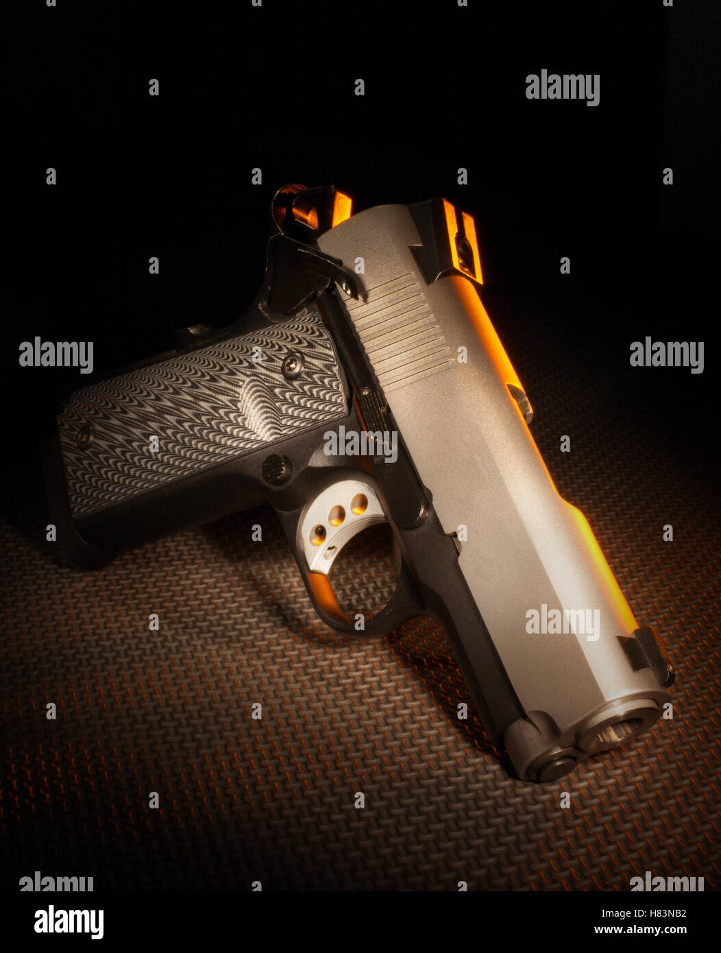 Semi automatic handgun that is on a dark rubber background Stock Photo ...