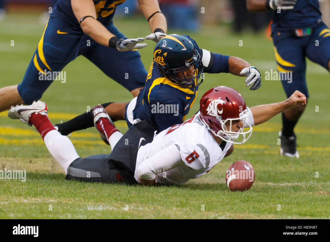 Nov 5, 2011; San Francisco CA, USA;  Washington State Cougars punter Daniel Wagner (6) is tackled by California Golden Bears defensive back Marc Anthony (2) after fumbling the snap on a field goal attempt during the second quarter at AT&T Park. Stock Photo