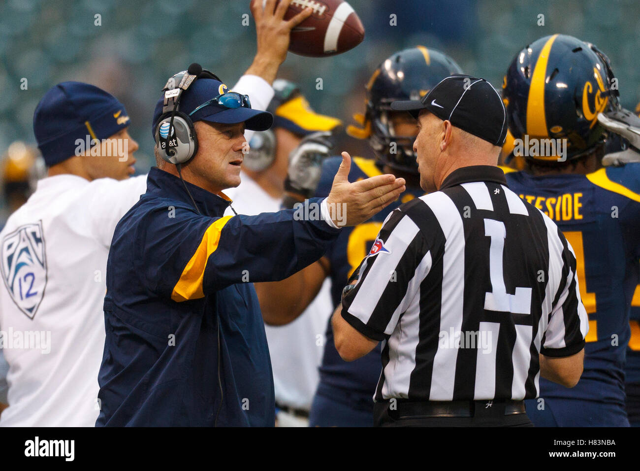 Nov 5, 2011; San Francisco CA, USA;  California Golden Bears head coach Jeff Tedford (left) argues a call with line judge Randy Campbell during the second quarter against the Washington State Cougars at AT&T Park. Stock Photo