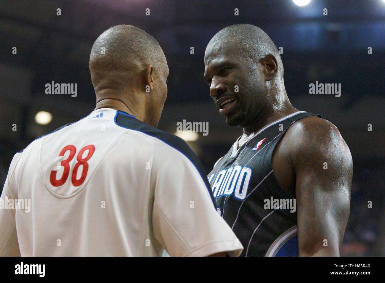 Jan 8, 2012; Sacramento, CA, USA; Orlando Magic shooting guard Jason Richardson (right) talks to NBA referee Michael Smith (38) during the third quarter against the Sacramento Kings at Power Balance Pavilion. Orlando defeated Sacramento 104-97. Stock Photo