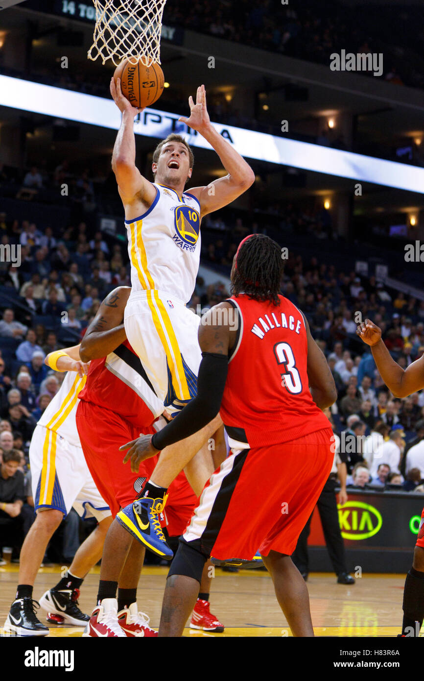Jan 25, 2012; Oakland, CA, USA; Golden State Warriors power forward David Lee (10) shoots in front of Portland Trail Blazers small forward Gerald Wallace (3) during the first quarter at Oracle Arena. Golden State defeated Portland 101-93. Stock Photo