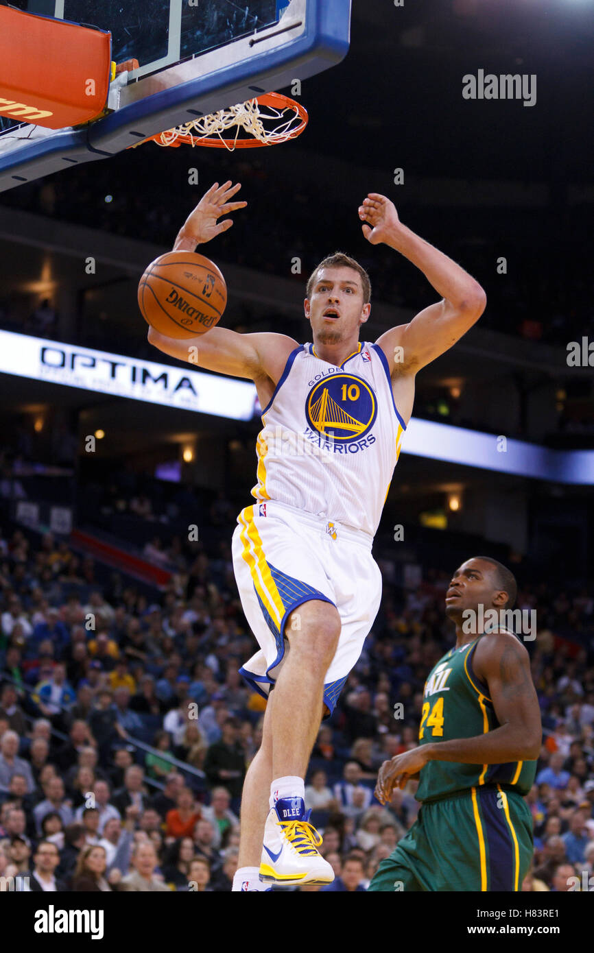Feb 2, 2012; Oakland, CA, USA; Golden State Warriors power forward David Lee (10) dunks against the Utah Jazz during the first quarter at Oracle Arena. Stock Photo