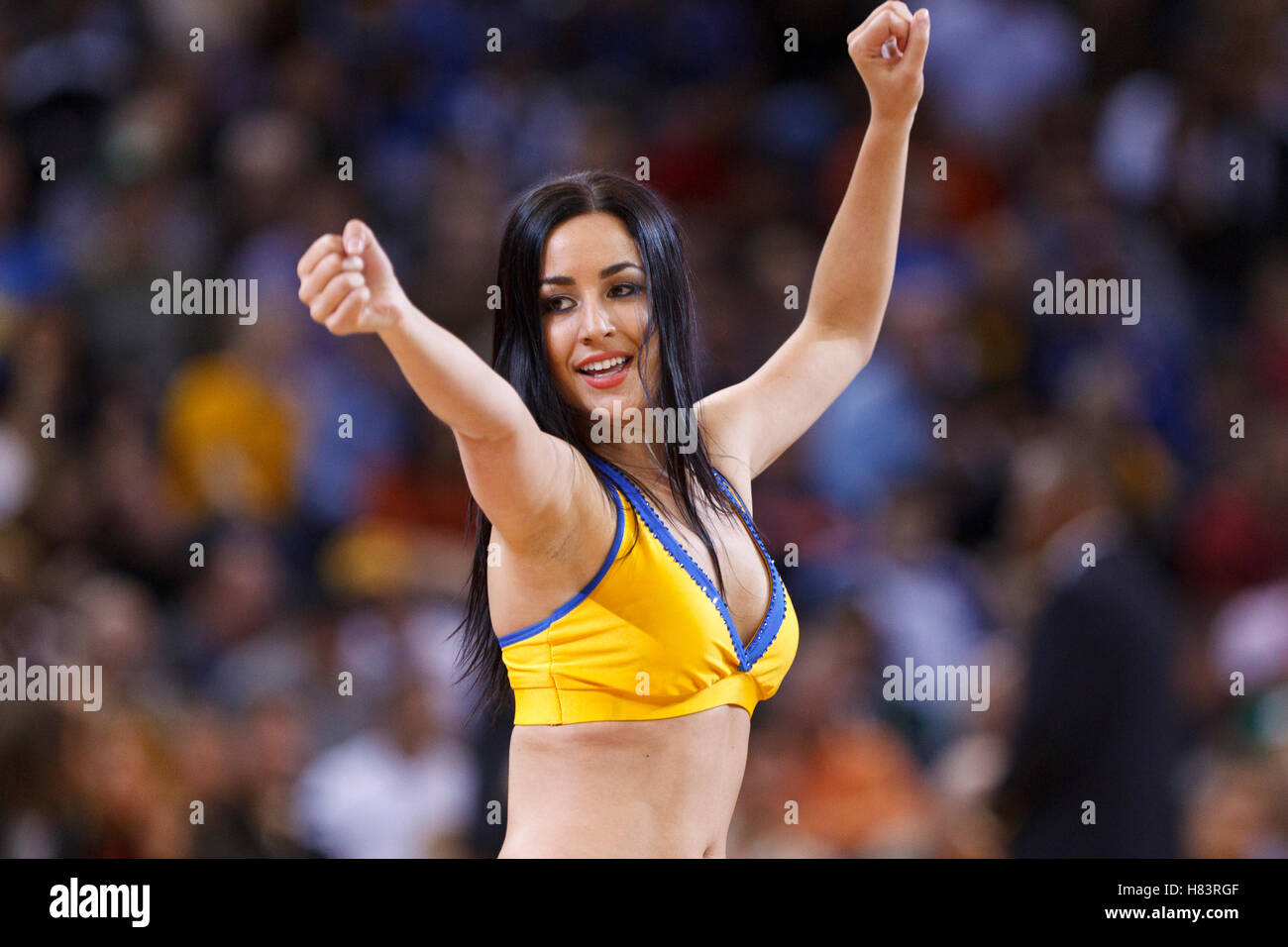 Feb 2, 2012; Oakland, CA, USA; A Golden State Warriors cheerleader performs during the third quarter against the Utah Jazz at Oracle Arena. Golden State defeated Utah 119-101. Stock Photo