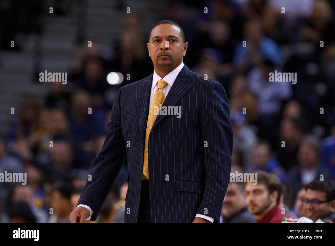 Feb 15, 2012; Oakland, CA, USA; Golden State Warriors head coach Mark Jackson on the sidelines against the Portland Trail Blazers during the first quarter at Oracle Arena. Portland defeated Golden State 93-91. Stock Photo