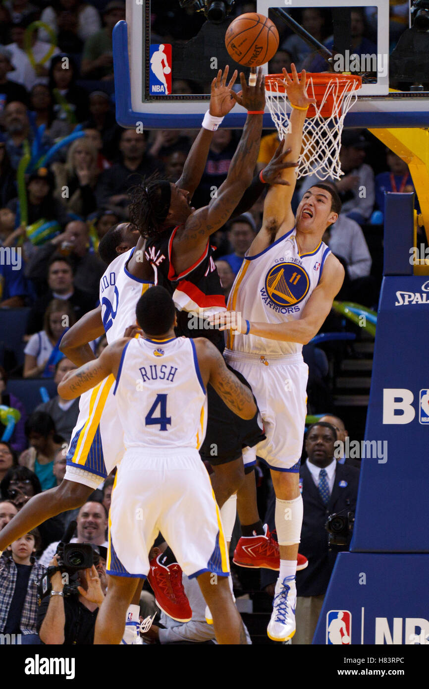 Feb 15, 2012; Oakland, CA, USA; Portland Trail Blazers small forward Gerald Wallace (3) is fouled by Golden State Warriors guard Klay Thompson (11) during the fourth quarter at Oracle Arena. Portland defeated Golden State 93-91. Stock Photo