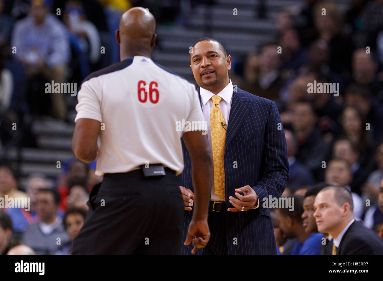 Feb 15, 2012; Oakland, CA, USA; Golden State Warriors head coach Mark Jackson argues a call with NBA referee Haywoode Workman (66) during the third quarter against the Portland Trail Blazers at Oracle Arena. Portland defeated Golden State 93-91. Stock Photo