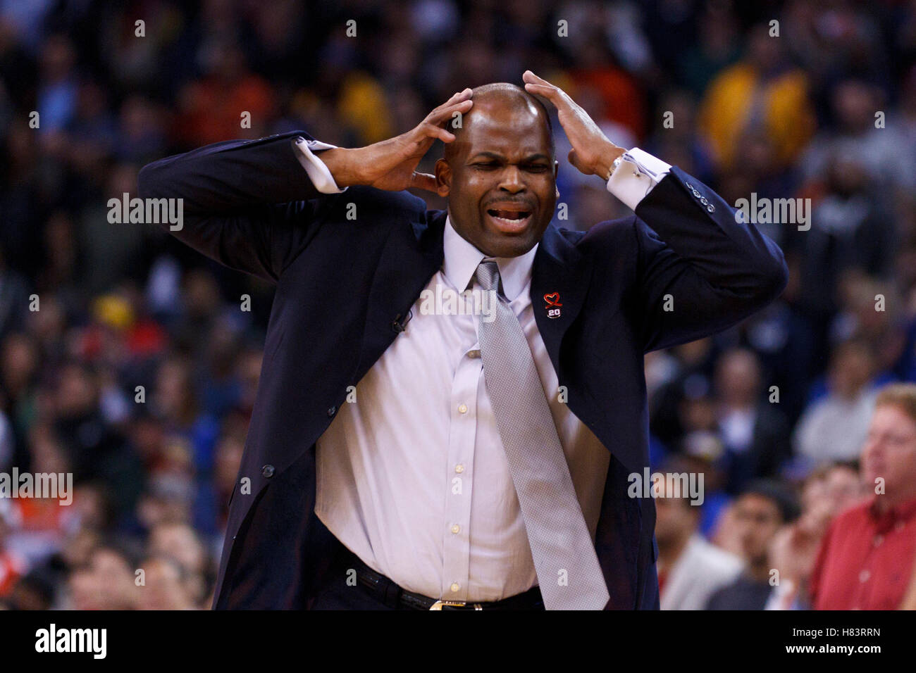 Feb 15, 2012; Oakland, CA, USA; Portland Trail Blazers head coach Nate McMillan reacts to a play against the Golden State Warriors during the fourth quarter at Oracle Arena. Portland defeated Golden State 93-91. Stock Photo