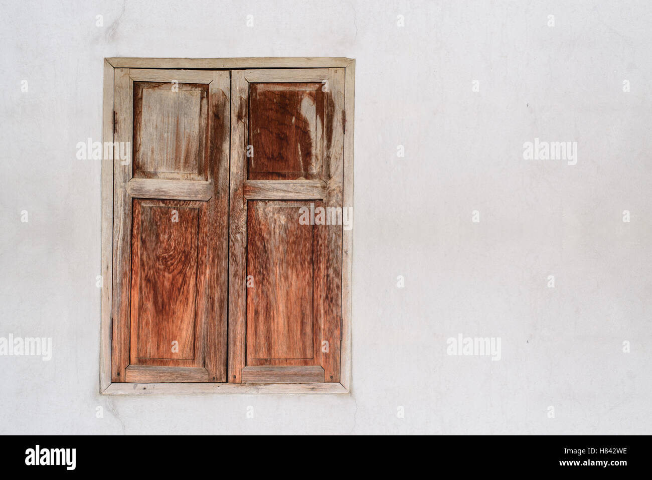 old wooden window on concrete wall Stock Photo - Alamy