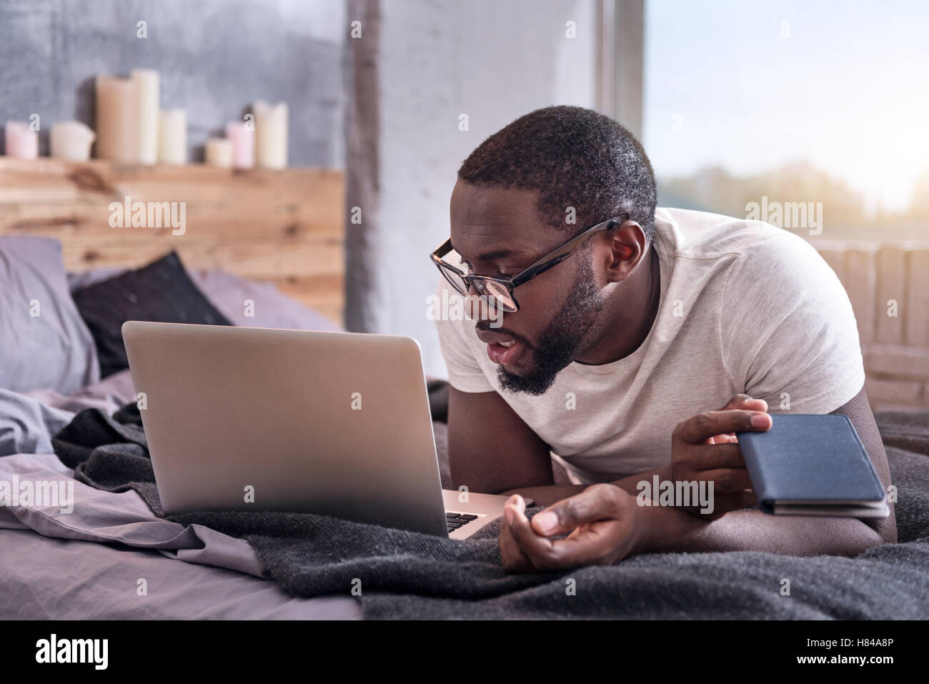 African man looking at his laptop Stock Photo