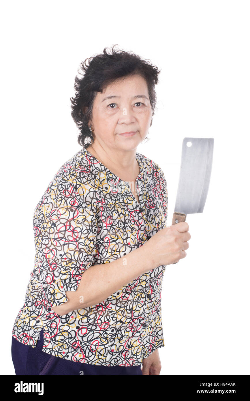 Asian old woman holding chopping knife in hand, isolated on white