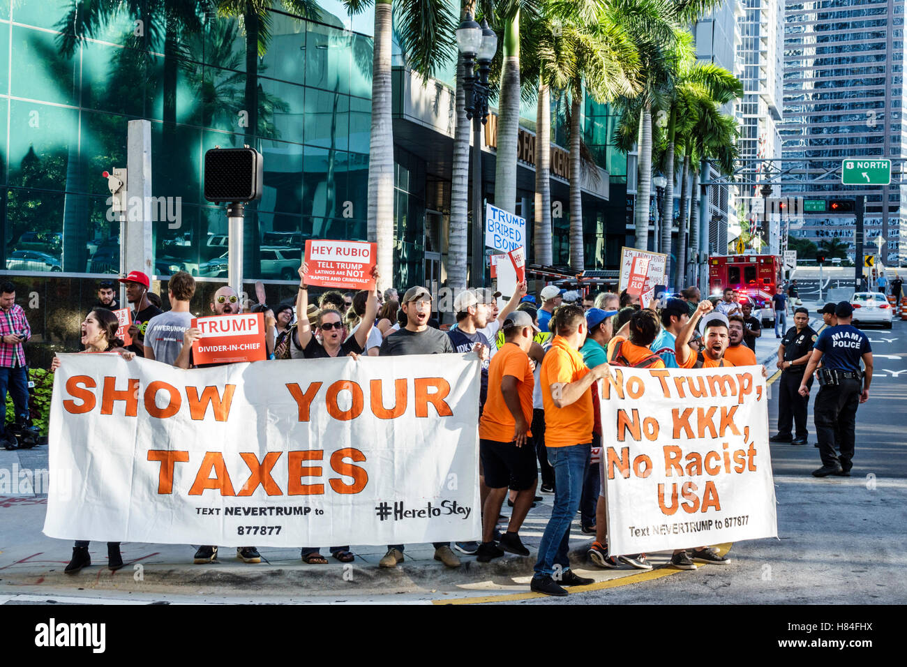 Miami Florida,protesters,signs,protest,2016 presidential campaign,Rubio Trump,MoveOn.org,immigration,NeverTrump,Hispanic man men male,woman female wom Stock Photo