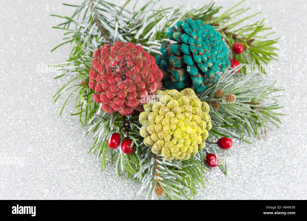 Pinecones and fir tree on sparkling background. Christmas decoration background Stock Photo