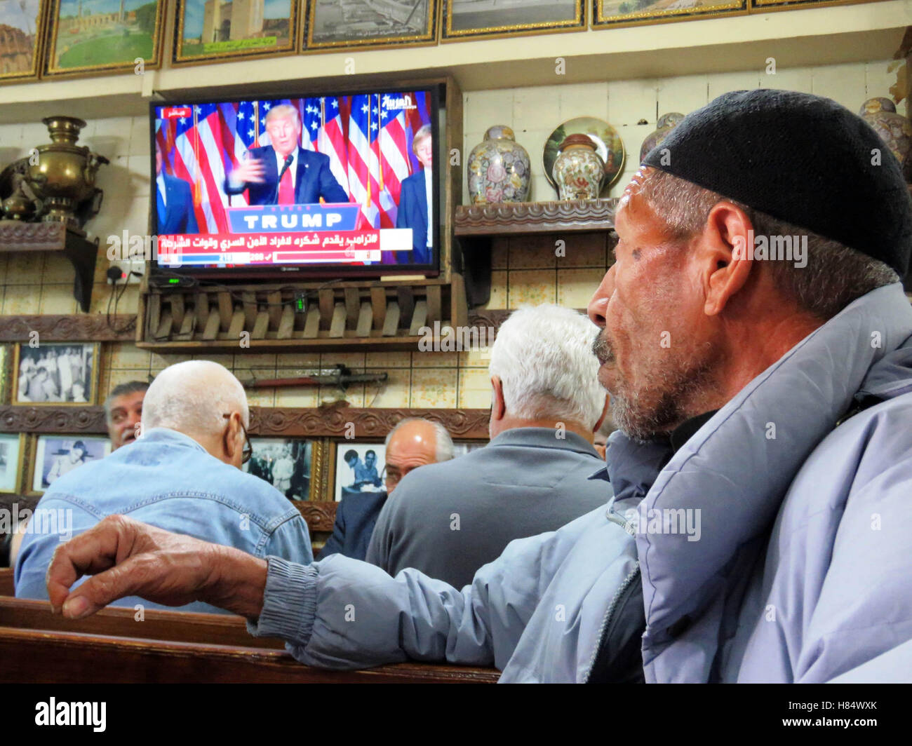 Baghdad, Iraq. 9th Nov, 2016. Iraqi men watch television which shows the winner of the U.S. presidential election Donald Trump in Baghdad, Iraq, Nov. 9, 2016. Credit:  Khalil Dawood/Xinhua/Alamy Live News Stock Photo