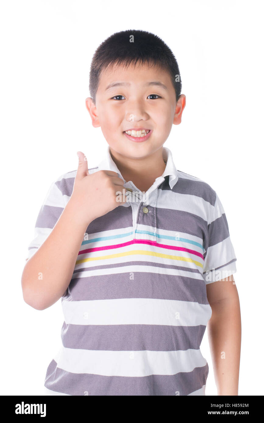 Asian boy giving you thumbs up over white background, isolated Stock ...