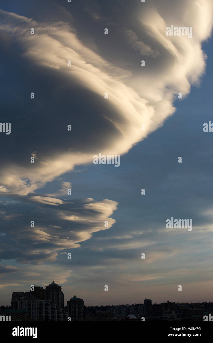 Dramatic clouds over city Stock Photo