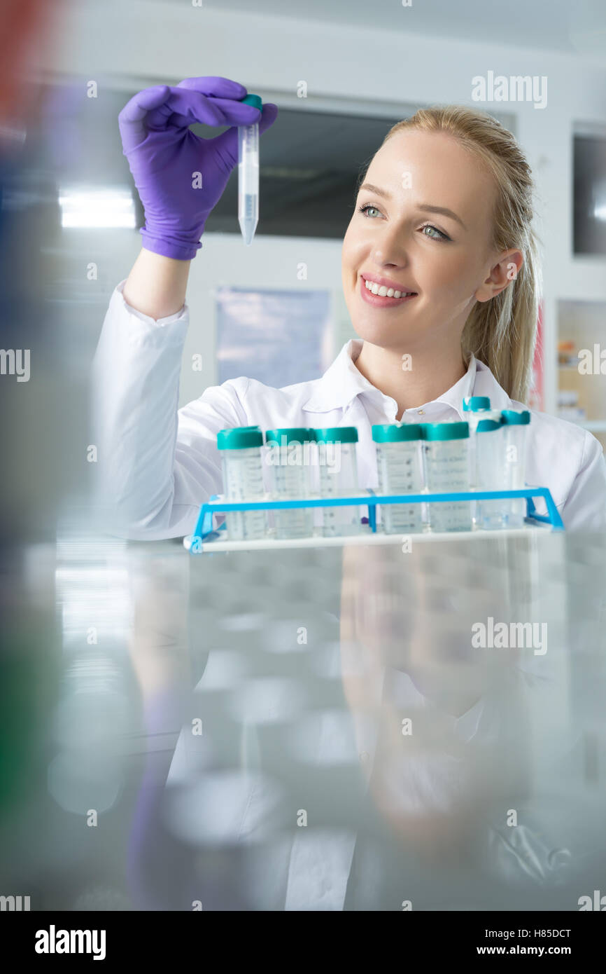 Young scientist in lab coat hi-res stock photography and images - Alamy