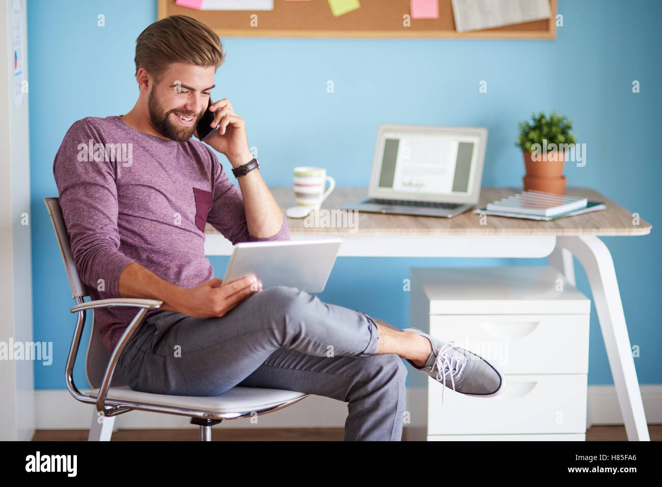 Man Using Devices Digital devices used by young and cheerful man Stock Photo - Alamy