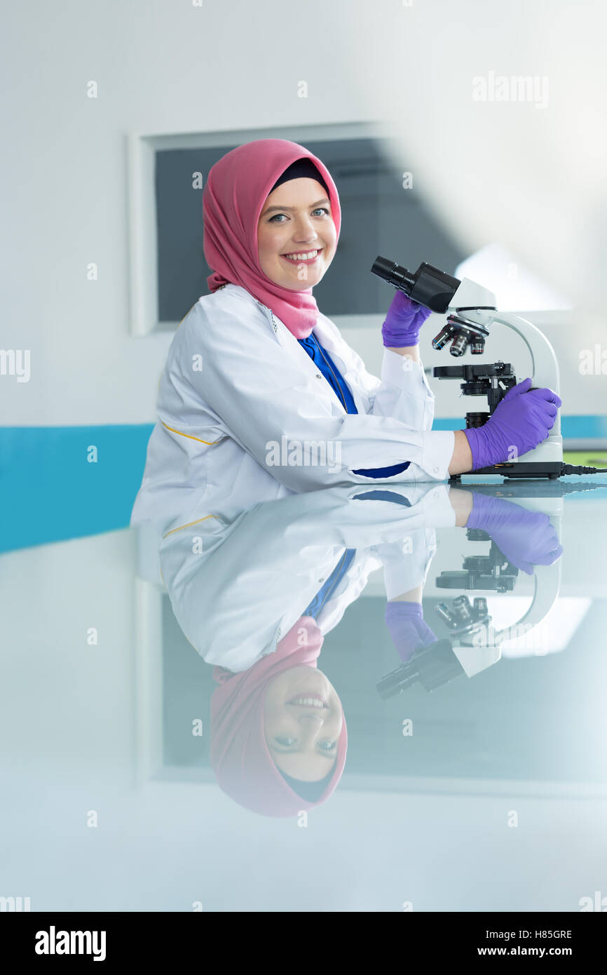 Muslim Lab Worker With Hijab Or Researcher Doing An Analysis In 