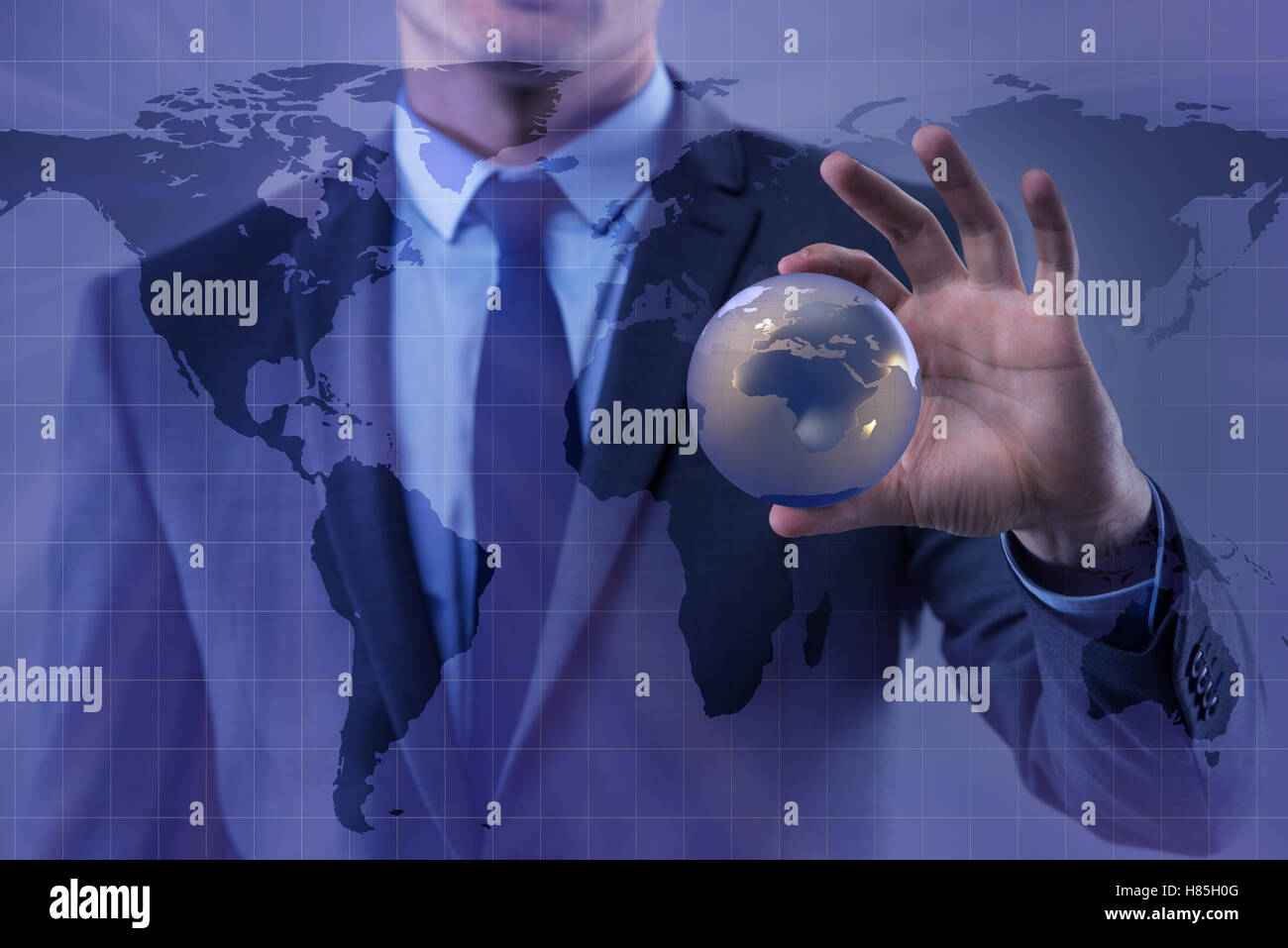 Businessman holding globe in global business concept Stock Photo - Alamy