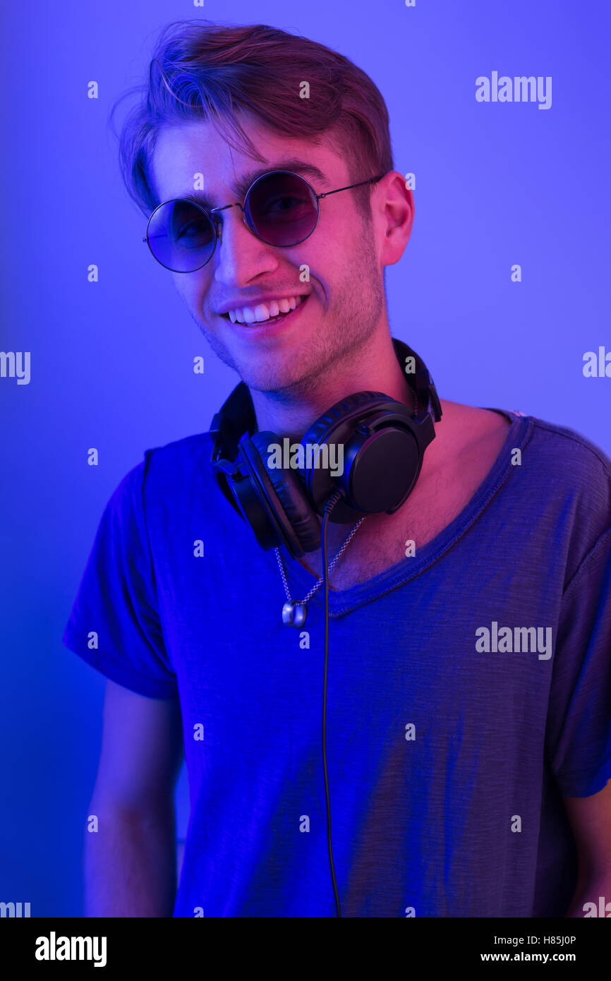 dj with headphones in party scene, toned image Stock Photo