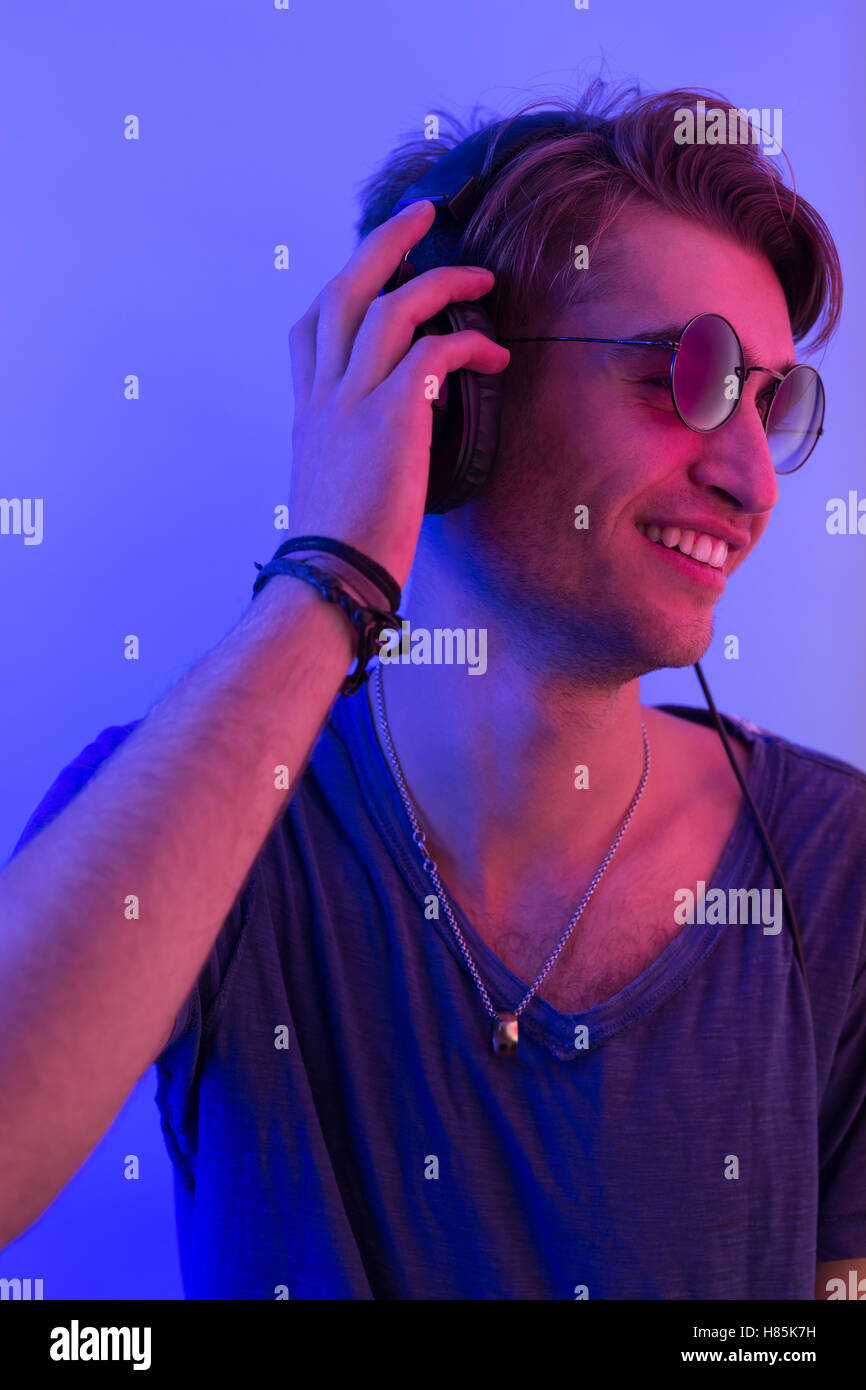 dj with headphones in party scene, toned image Stock Photo