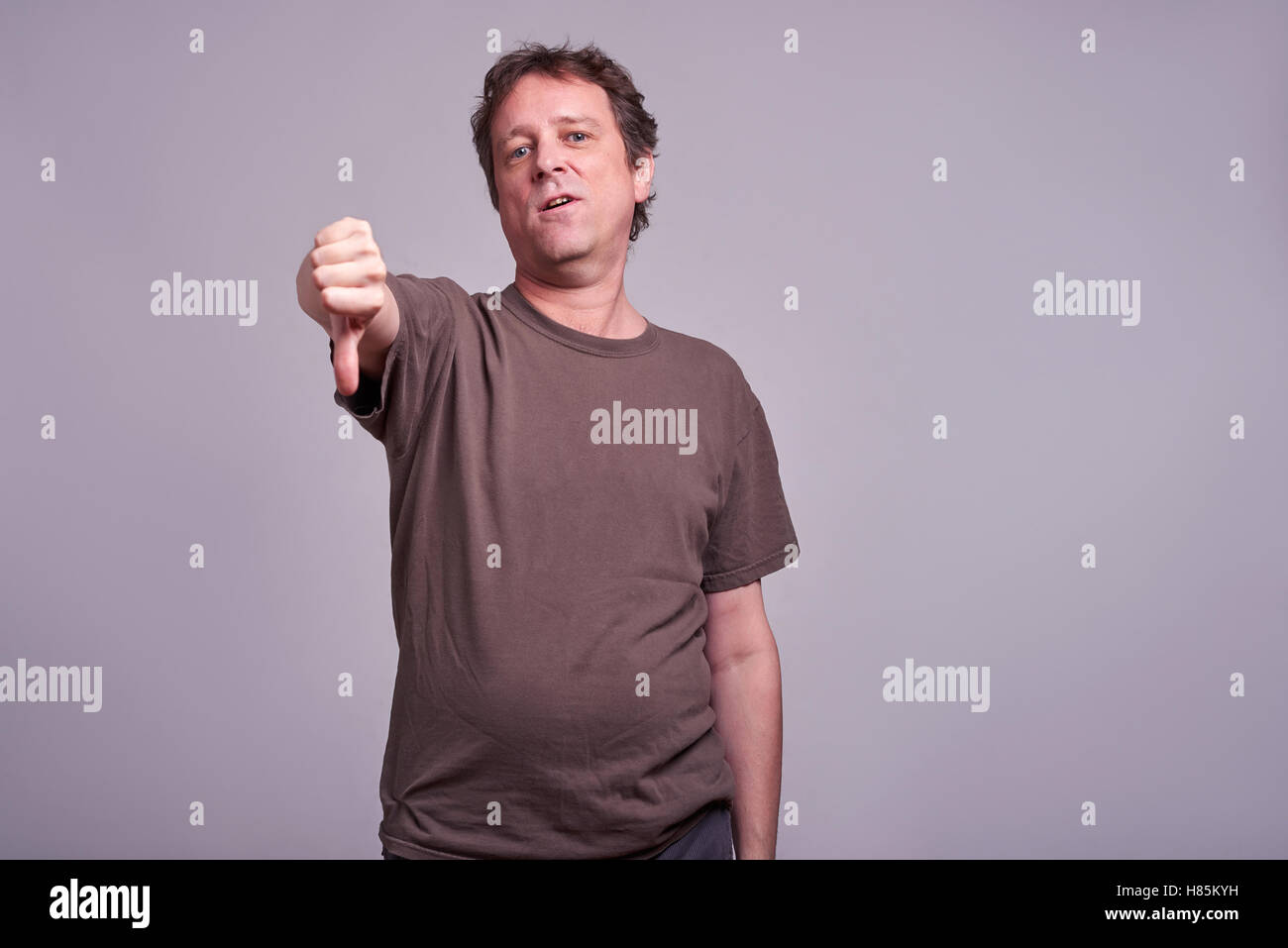 Thumbs down middle age man hi-res stock photography and images - Alamy