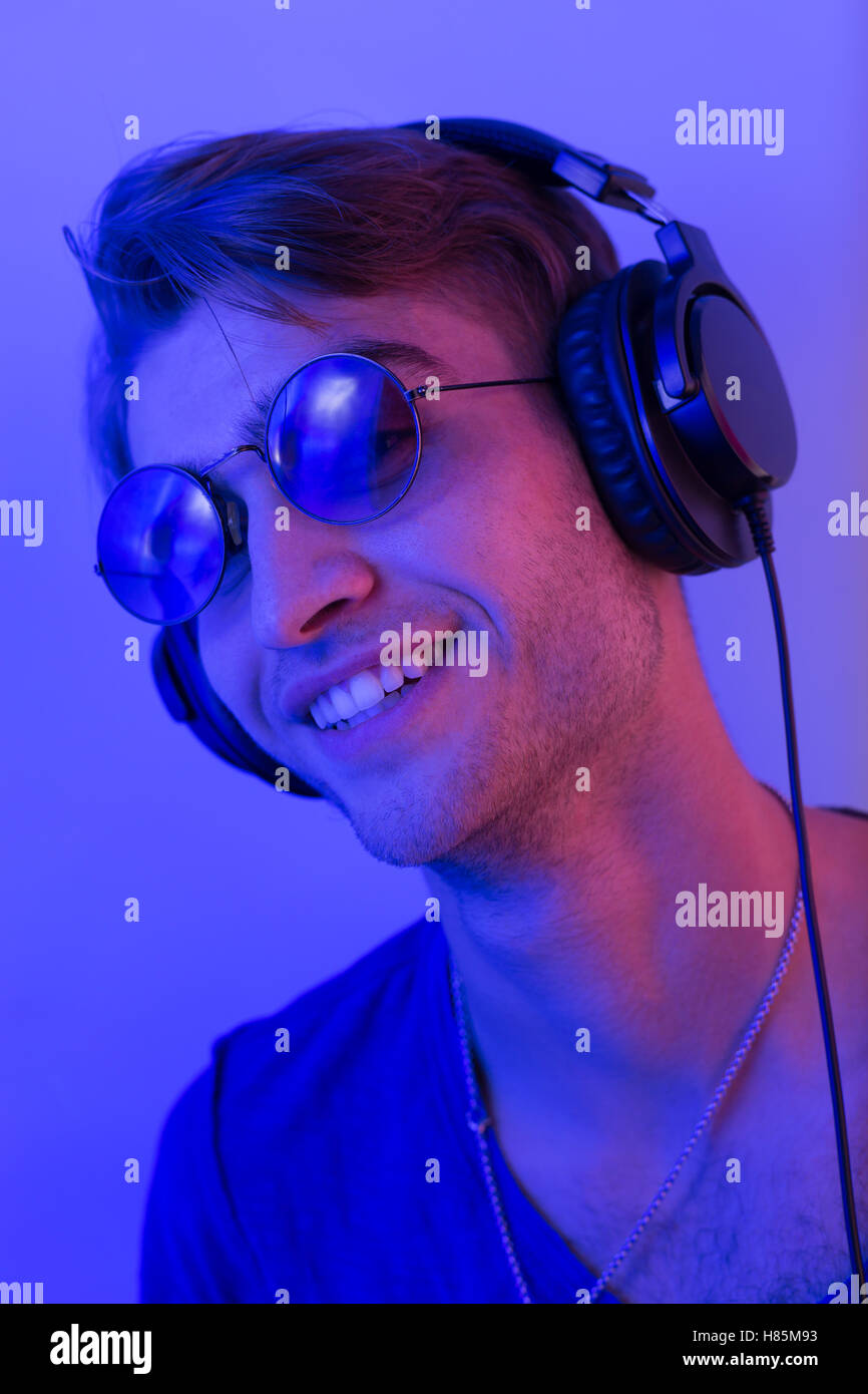 dj with headphones in party scene, toned image Stock Photo