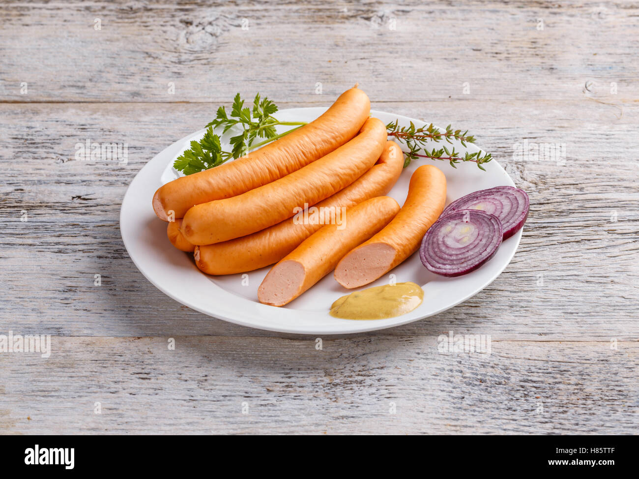 Hot Dog sausages on white plate Stock Photo