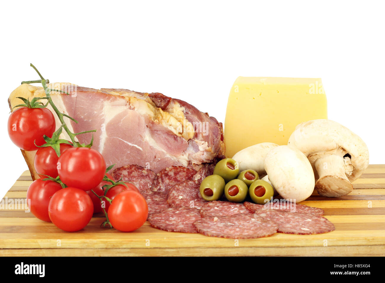 smoked ham cheese salami mushrooms and tomatoes Stock Photo