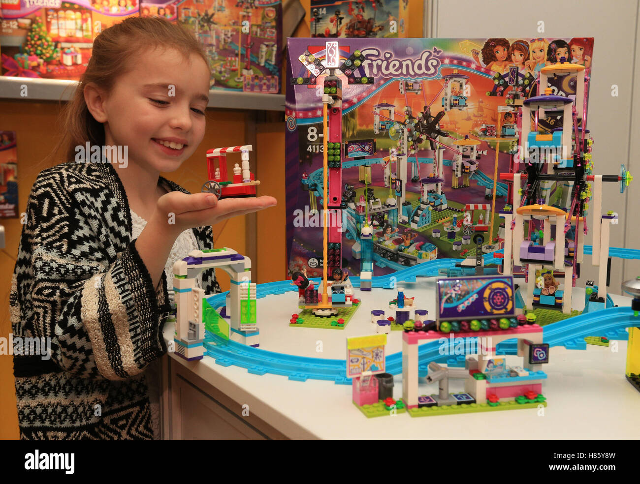 Isabella Parlour, 7, plays with Lego Friends Amusement Park Roller Coaster  at the DreamToys 2016 event held at St Mary's Church, Marylebone, London  Stock Photo - Alamy